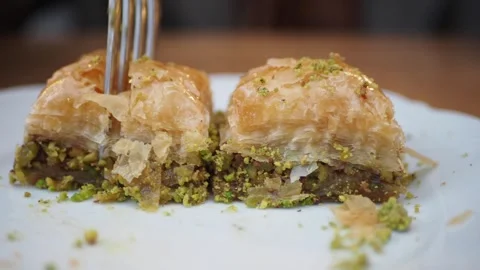 Fork pick turkish dessert baklava closeup Stock Footage 279960838