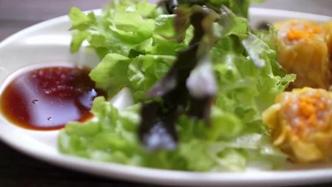 Fork picking up a delicious Chinese shrimp dumpling Stock Footage 336230060