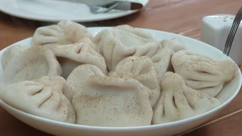 Fork picking up a Georgian Khinkali dumpling Stock-Footage 315360989