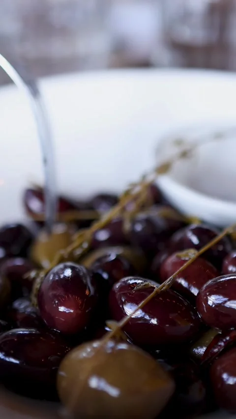 Fork Picking Marinated Olives in Close-Up Stock-Footage 312653245