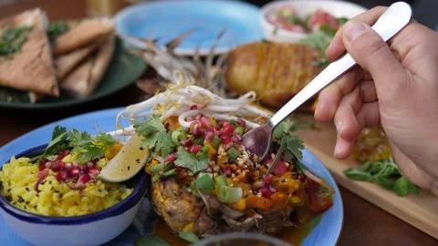 Fork picking thai curry served in a pineapple. Healthy oriental plant-based Stock Footage 139528720
