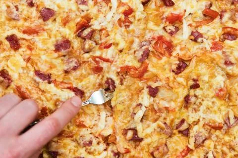 Fork in the pizza Stock Photos