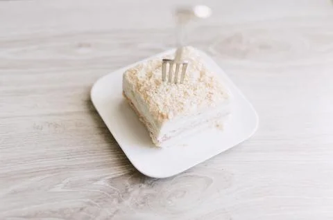 A fork is on a plate with a piece of cake Stock Photos