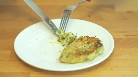 Fork is on a plate with a piece of food on it Stock Footage 317030732