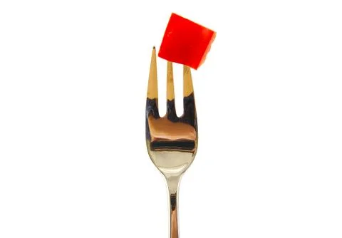 Fork with red pepper isolated on white background. Stock Photos
