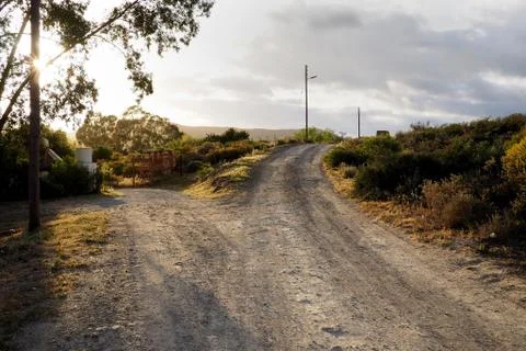 A fork in the road on a dirt road in the countryside Stock Photos