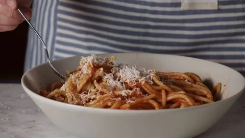 Fork rolling spaghetti. Close Up view. Red tomato spaghetti with parmesan cheese Stock Footage 230421599