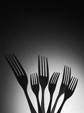 Fork Shadows Rising In Group Minimal Black And White Concept Foto stock