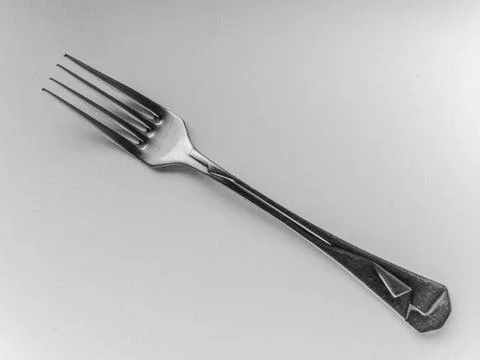 Fork is shown on a white background Stock Photos