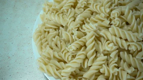 Fork in slow motion takes pasta from a plate Stock Footage 126897608