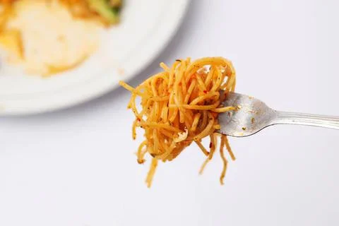 Fork with spaghetti noodles on a white background Stock Photos