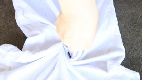 Fork Spiralling  Technique used on a Shirt for Tie Dying Stock Footage 202807044