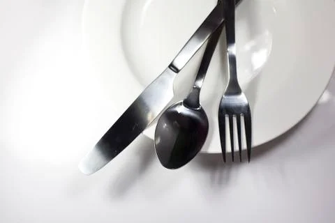 Fork spoon and knife isolated on white Stock Photos