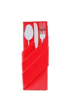 Fork, spoon and knife in a red cloth isolated on white Stock Photos