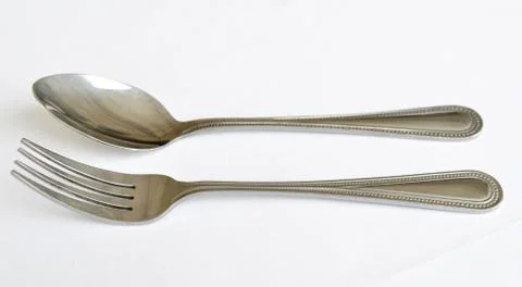 Fork spoon and knife on the table Stock Photos