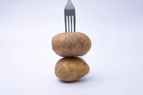 Fork with a stack of potatoes 스톡 사진