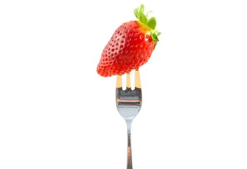 Fork with strawberry isolated on white. Stock Photos