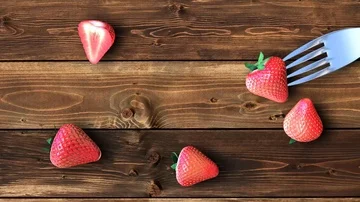 Fork with strawberry on the wooden table Stock Footage 85998179