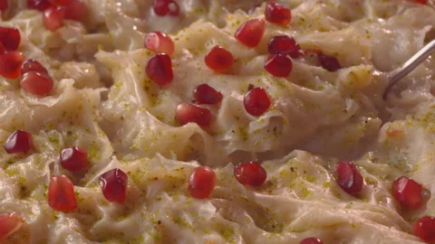 Fork takes a piece of rose pudding (Güllaç) and lifts it up Stock Footage 147225683