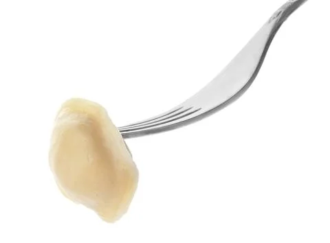 Fork with tasty dumpling isolated on white Stock Photos