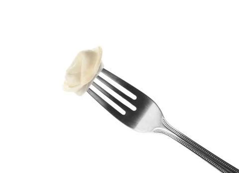 Fork with tasty dumpling isolated on white Stock Photos