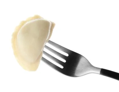 Fork with tasty dumpling isolated on white Stock Photos