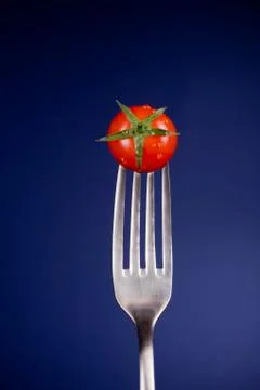 Fork with tomato Stock Photos