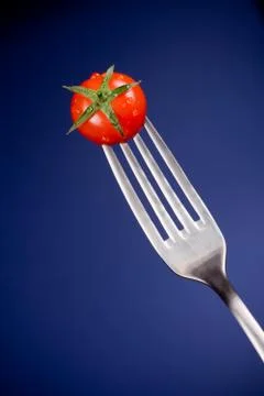 Fork with tomato Stock Photos