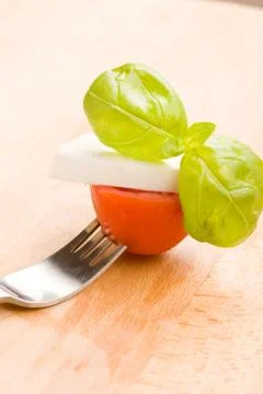 Fork with tomatoe and mozzarella Stock Photos