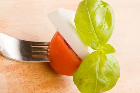Fork with tomatoe and mozzarella Stock Photos