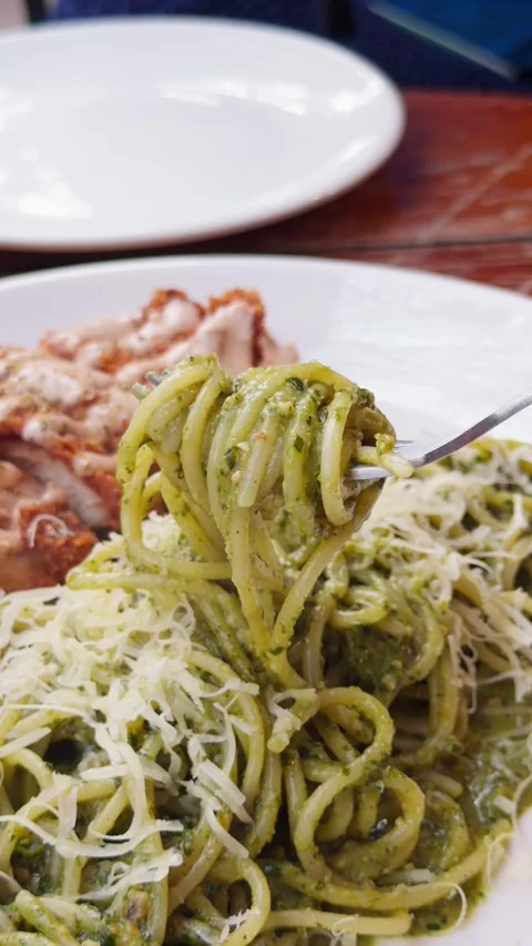 Fork Twirling Green Pesto Spaghetti Close-Up Italian Pasta Action Shot Vídeos de archivo 340494583