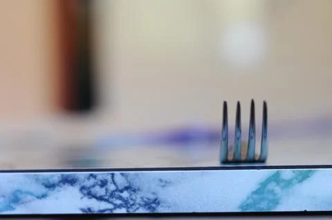 Fork upright on marble surface, highlights simplicity and minimalism in desig Stock Photos