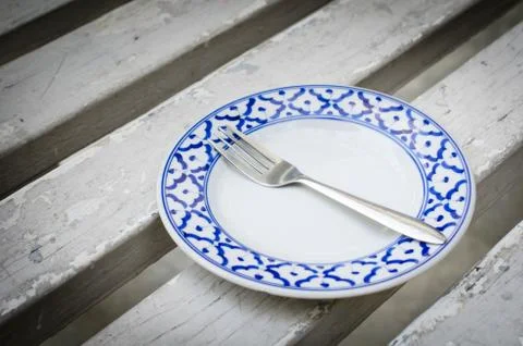 Fork on vintage empty plate Stock Photos