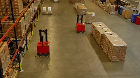 Forked Automatic Guided Vehicles (AGV) pallet truck, unmanned driving, 4K Video stock 72669918