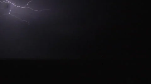 Forked Lightning Bolt Streaks Through Cloud at Night Stock Footage 54725861