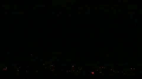 Forked lightning strikes buildings at night Stock Footage 360441