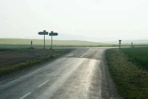 Forked road in countryside Stock Photos