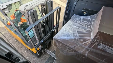 Forklift Approaching and Unloading Pallet from Delivery Van Stock Footage 333937032