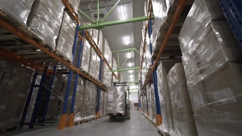 Forklift with boxes moves through warehouse of cardboard plant Stock Footage 295653930
