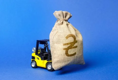 Forklift carries a huge money bag with the symbol of UA ukrainian hryvnia. .. Stock Photos