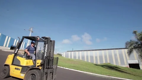 Forklift crossing the camera in industry Stock Footage 69850343