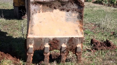 Forklift digging a hole in the soil Stock Footage 73457067