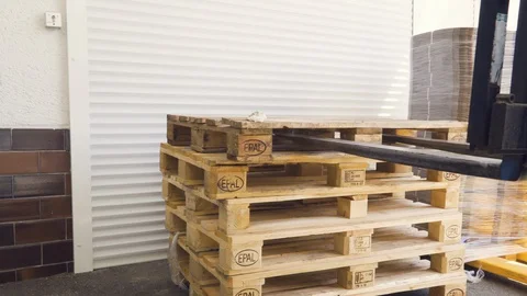 Forklift driver loading empty EPAL pallet, 4K. Stock Footage 130163721