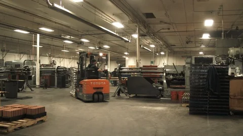 Forklift Driver Maneuvers Through Factory 2 Video stock 88840232