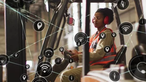 Forklift driver reaching sensor donning muffs steering as net icons spreading Video stock 330741519