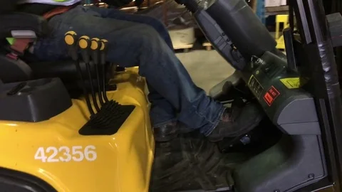 Forklift Driver Unloads Pallet Video stock 82213639
