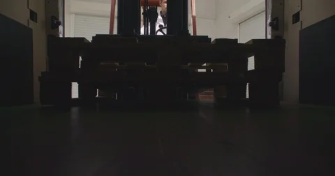 Forklift driver, worker unload pallets from a van, truck. 4K Stock Footage 117296387