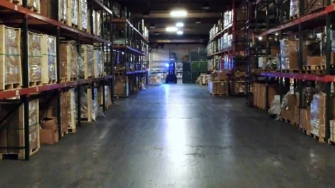 Forklift driving through warehouse 스톡 동영상 151855121
