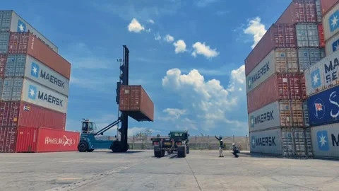 A forklift handles a shipping container Stock Footage 312021952