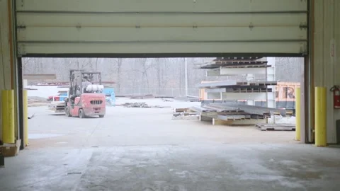Forklift leaving workshop Stock Footage 238860307